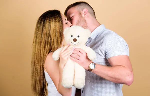 Future parents. Happy family. Valentines day holiday. Soft toy teddy bear gift. Pregnancy concept. Man and woman couple in love. Family love. Man and pretty girl in love. Guy and girl cuddling