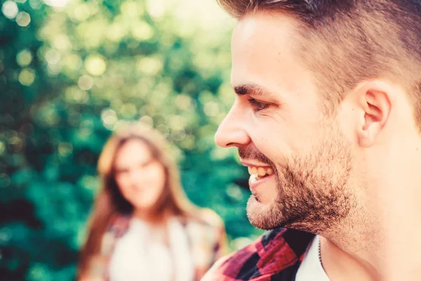 Lovely date. couple first meet outdoor. Relations. man in selective focus with girl in park. happy valentines day. summer camping in forest. family weekend. romantic date. couple in love