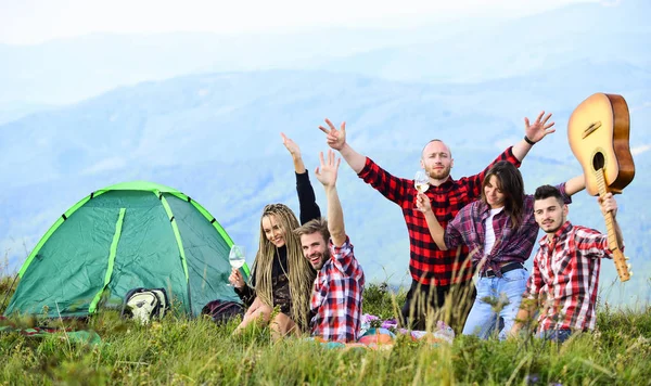 Hike picnic. Friends enjoy vacation. Pleasant hike picnic. People eating food. Camping concept. Youth having fun picnic in highlands. Summer adventures. Group friends relaxing picnic in mountains