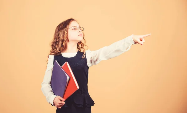 Prepare for exam. Preparing to exams in library. Small child formal wear. Formal education and homeschooling. Check knowledge. Final exam coming. Girl hold textbook folder test. School exam concept — Stock Photo, Image