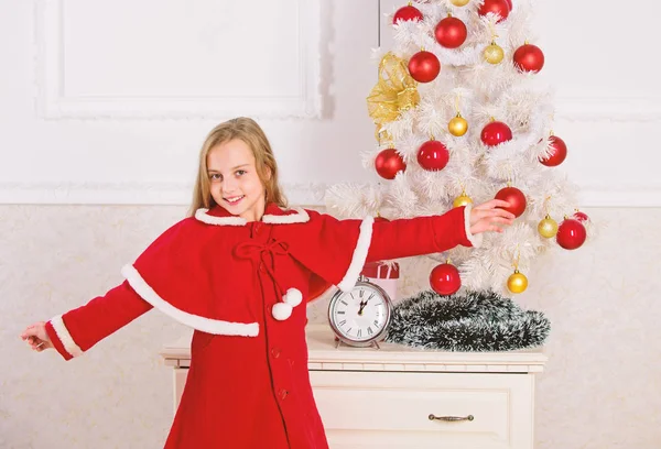 Get incredibly excited about christmas. Kid girl festive costume near christmas tree. Childhood happiness concept. Child celebrate christmas at home. Favorite day of the year. Christmas celebration — Stock Photo, Image