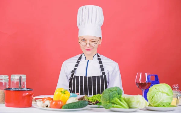 Female in apron knows everything about culinary art. Culinary education. Culinary expert. Woman chef cooking healthy food. Fresh vegetables ingredients for cooking meal. Culinary school concept