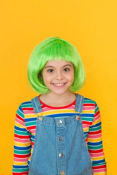 Kid girl with bright vibrant hairstyle. Artificial wig concept. Pigment dye hair. Freedom for expression. Fantasy hair trend. Semi permanent color cream. Colored clip in hair extensions. Change color — Stock Photo, Image