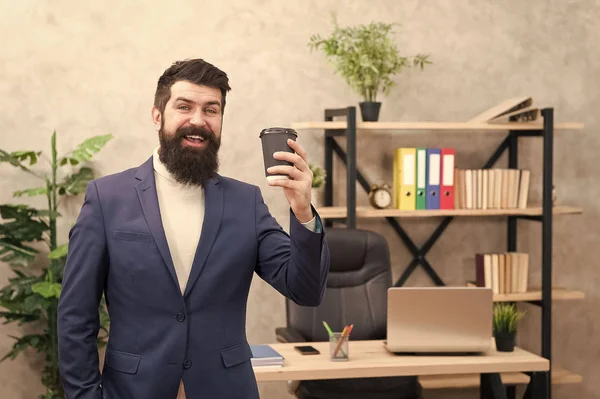 Cup of coffee may actually help to contribute to overall happiness. Bearded manager hold cup coffee. Relaxed top manager drinking coffee. Boss enjoying energy drink. Worker start day with hot coffee