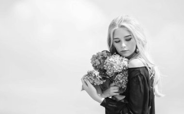 Girl fashion model carry hydrangea flowers. Spring fresh bouquet. Flowers tender spring fragrance. Bouquet for girlfriend. Fashion and beauty industry. Celebrate spring. Gardening and botany concept