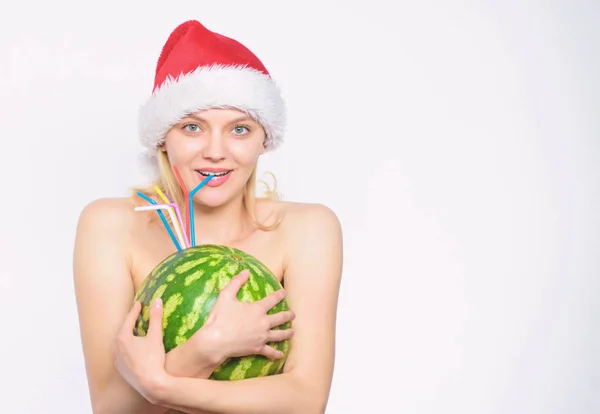 Tips to celebrate summer christmas. New year and christmas concept. Exotic christmas holidays. Countries that celebrate christmas in summer. Girl attractive naked wear santa hat hug watermelon