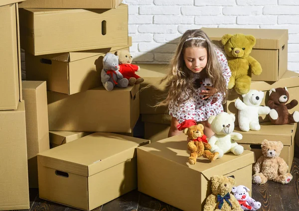 Teddy bear collection. Sweet home. Girl child relaxing after unpacking boxes. Moving in. Delivering service. Feeling good at home. Playroom concept. All she needs are toys. Home is where are my toys — Stock Photo, Image