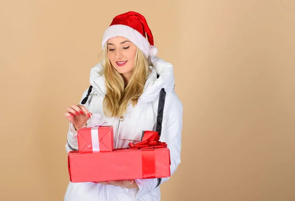 Christmas gifts for customers. Loyalty program. Christmas mood. Winter clothes. Girl wear winter white jacket and hat. Santa girl. Fashion trend. Winter season. Accessory for celebration. Get bonus