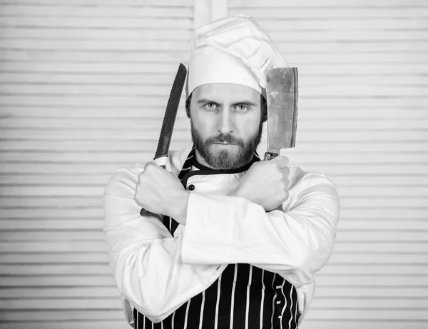 Ready to work. confident man in apron and hat hold knife. bearded man loves eating food. cook in restaurant, uniform. Professional in kitchen. culinary cuisine. chef ready for cooking — Stock Photo, Image