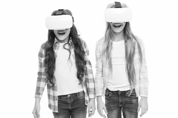 Virtual education. Kids wear hmd explore virtual or augmented reality. Future technology. Girls interact cyber reality. Play cyber game and study. Modern education. Alternative education technologies