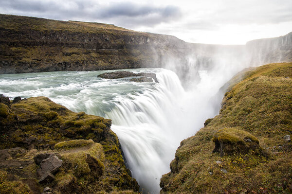 Canyon beauty. Waterfall located in canyon river Iceland. River rapid waterfall. Water beautiful stream flow. Nature landscape. Iceland tourist destinations concept. Waterfall in Iceland. Wet air