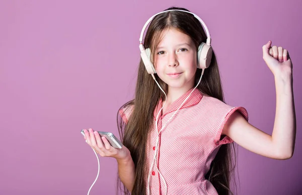 Favorite song. child study online. E learning with ebook. small girl pupil in headphones. home schooling. girl listen to music. Audio book. back to school. self education. Mp3 player — Stock Photo, Image