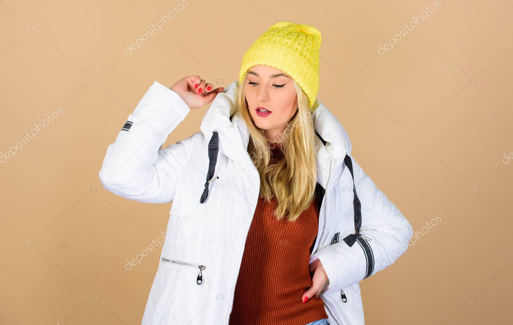 Winter activities. beauty in winter clothing. cold season shopping. happy winter holidays. New year. flu and cold. seasonal fashion. woman in padded warm coat. girl in beanie hat. faux fur fashion
