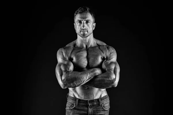 Being enthusiastic for sports. Sportsman or sport man keeping strong arms crossed. Sexy fit man with athletic torso on black background. Taking sports to stay in shape. Physical training and sports — Stock Photo, Image