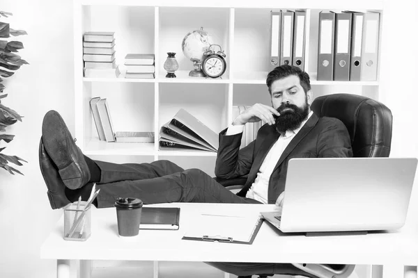 Done enough for today. Man bearded hipster boss sit in leather armchair office interior. Boss at workplace. Manager formal clothing corporate style working. Business people concept. Lazy boss office — Stock Photo, Image