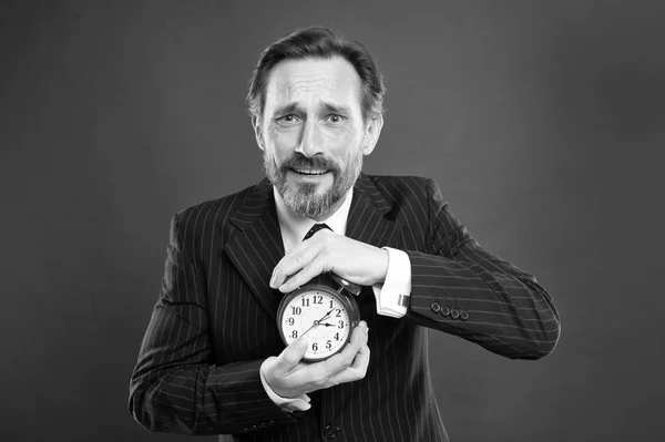 Time management skills. How much time left till deadline. Manager with alarm clock. Man bearded businessman hold clock. Mature man beard ready start working. Time to work. Businessman care about time — Stock Photo, Image