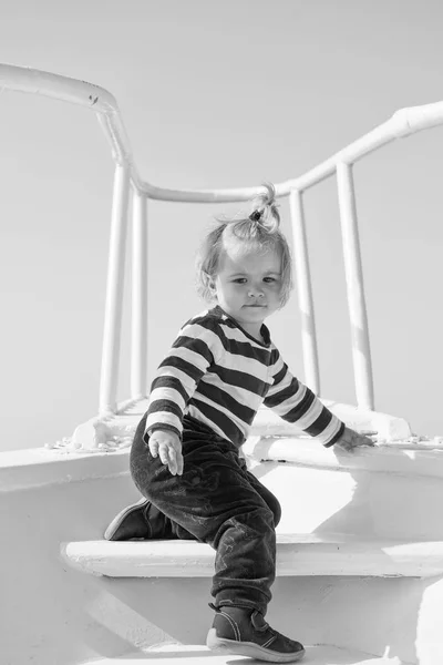 Summer vacation. childhood happiness. happy small boy on yacht. boat trip by sea or ocean. funny kid in striped marine shirt. small sailor on boat. summer traveling and wanderlust. summer concept — Stock Photo, Image