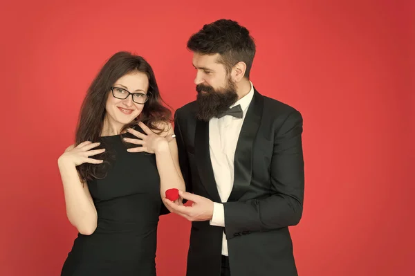 Romantic valentines day. sexy couple in love. tuxedo man and elegant lady at engagement party. formal couple. ring in box. bearded man make woman marriage proposal. love romantic date and romance — Stock Photo, Image