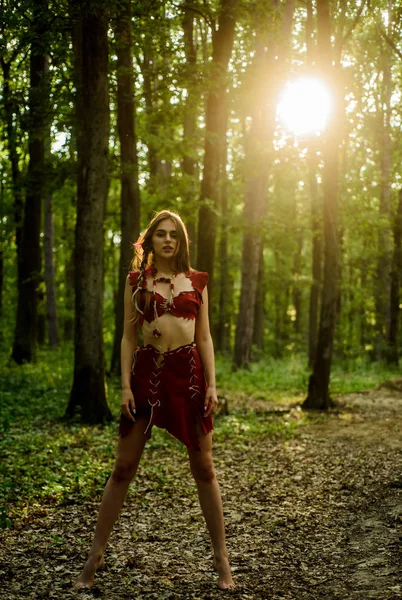 Forest fairy. Fashion and culture. Wilderness of virgin woods. Wild attractive woman in forest. Folklore character. Living wild life untouched nature. Sexy girl. Wild human. Female spirit mythology