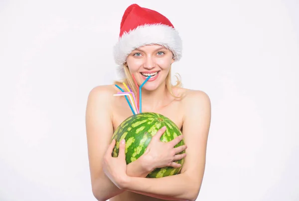 New year and christmas concept. Exotic christmas holidays. Girl attractive naked wear santa hat hug watermelon. Countries that celebrate christmas in summer. Tips to celebrate summer christmas