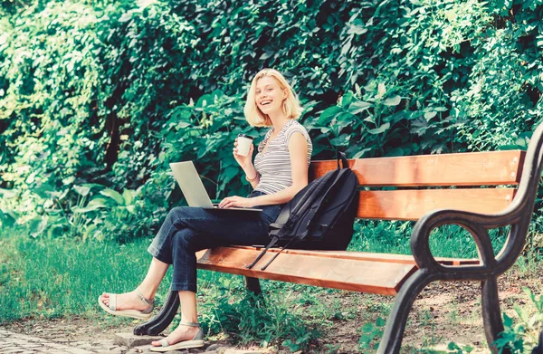 girl work on laptop. modern woman with computer outdoor. summer online. Morning chart. girl drink coffee to go. Relax in park. Pretty woman drinking takeaway coffee. Smart and confident student