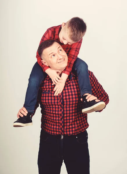 Having fun. Happiness being father of boy. Fathers day. Father example of noble human. Father little son red shirts family look outfit. Best friends forever. Dad piggybacking adorable child