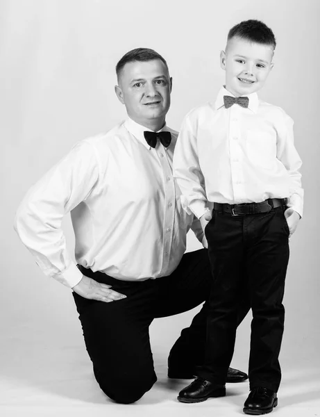 nobleman. little boy with dad businessman. family day. tuxedo style. happy child with father. business meeting party. trust and values. male fashion. father and son in formal suit. nobleman concept
