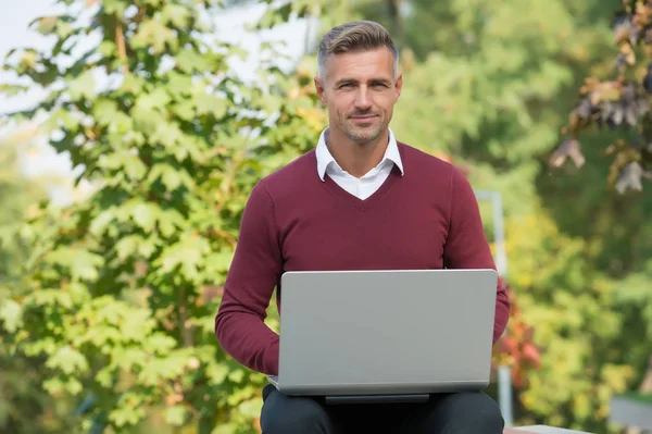 Green office. Inspiring innovations. Businessman inspired by nature guy feel powerful to change world. Man inspired hold laptop. Inspired for start up. Guy with computer in garden. Freelance concept