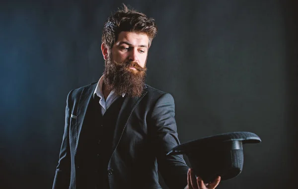 Man well groomed bearded gentleman on dark background. Male fashion and menswear. Formal suit classic style outfit. Elegant and stylish hipster. Retro fashion hat. Man with hat. Vintage fashion