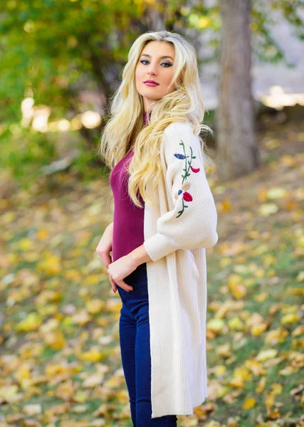 Feel so warm and comfortable. Autumn fashionable cardigan. Girl stylish outfit with soft wool or cashmere cardigan. Woman wear long knitted cardigan while walk in park. Fall fashion cozy cardigan