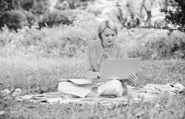 Business lady freelance work outdoors. Steps to start freelance business. Woman with laptop sit on rug grass meadow. Online or freelance career ideas concept. Guide starting freelance career