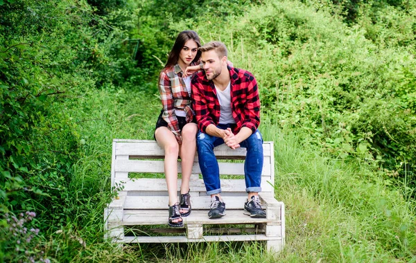 Never let me go. couple in love. family weekend. romantic date. man with girl in park. happy valentines day. summer camping in forest. couple relax outdoor on bench. Relations. checkered fashion