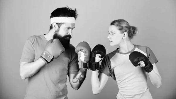 Sport for everyone. Amateur boxing club. Equal possibilities. Strength and power. Man and woman in boxing gloves. Family battle. Boxing sport concept. Couple girl and hipster practicing boxing