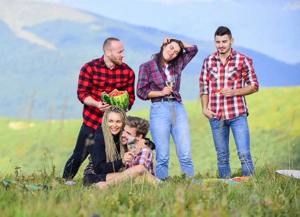 Open air party. Summer adventures. Celebrate holiday. Hike picnic. Group friends summer picnic. Friends enjoy vacation. People eating food drink alcohol. Youth having fun picnic in highlands — Stock Photo, Image