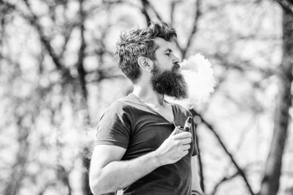 Mature hipster with beard. hipster man hold vaping device. Health safety and addiction. inhaling vapor. smoking e-cigarette. Bearded brutal male smoking electronic cigarette. Portrait of masculinity — Stock Photo, Image