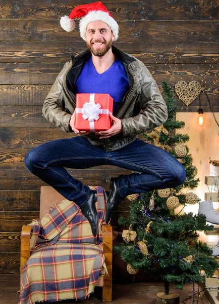 Delivery christmas present. Still have time. Delivery service. Gifts delivery. Man santa hat hurry to deliver gift on time. Christmas is coming. Spread happiness and joy. Bearded guy in motion jump