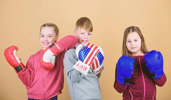 workout of small girls and boy boxer in sportswear. Happy children in boxing gloves. Fitness diet. energy health. punching knockout. Childhood activity. Sport. Team fight. Staying fit and healthy