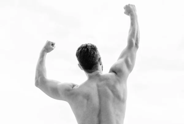 Victory and success. Champion and winner concept. Man celebrating success. Bodybuilder strong muscular body feeling powerful and superior rear view. Achieve success. Great shape. Successful athlete — Stok fotoğraf