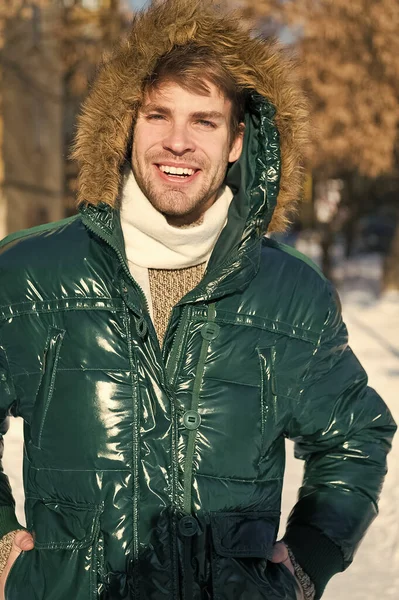 Man. It is cold outside. Forest in snow. Fresh air. Vacation and traveling. Happy man on winter holidays. Snowy weather. Trendy winter coat. Winter fashion. Warm clothes. Shopping in any weather — Stock Photo, Image