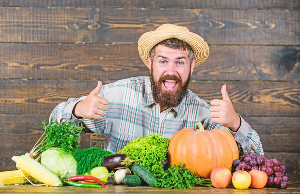 Local market. Homegrown vegetables. Buy vegetables local farm. Farm market harvest festival. Sell vegetables. Man bearded farmer with vegetables rustic style background. Locally grown crops concept