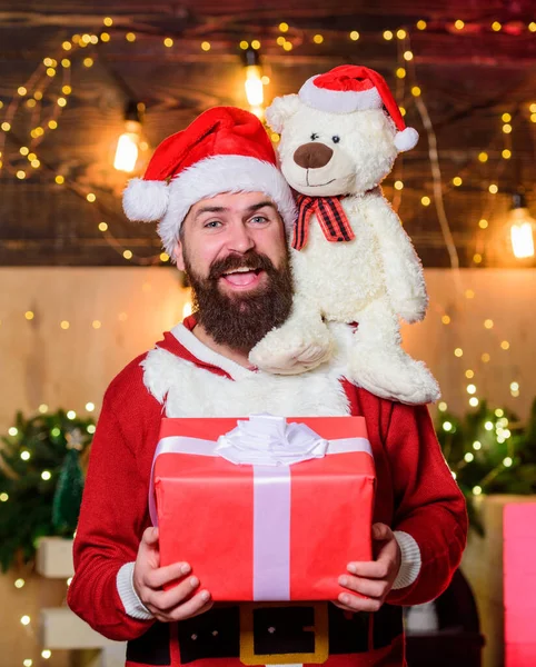Happy holiday. happy new year. Xmas bear toy present. winter shopping sales. Cheerful elf. christmas gift delivery. bearded man santa hat. bearded santa deliver presents. Christmas shopping