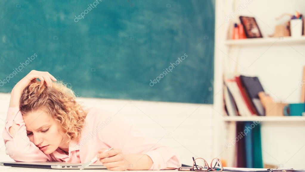 Tired tutor fall asleep at workplace. Tired student lean on desk. Exhausting lesson. Teacher exhausted after hard working day. Woman tired in school classroom. School pedagogue stressful occupation.