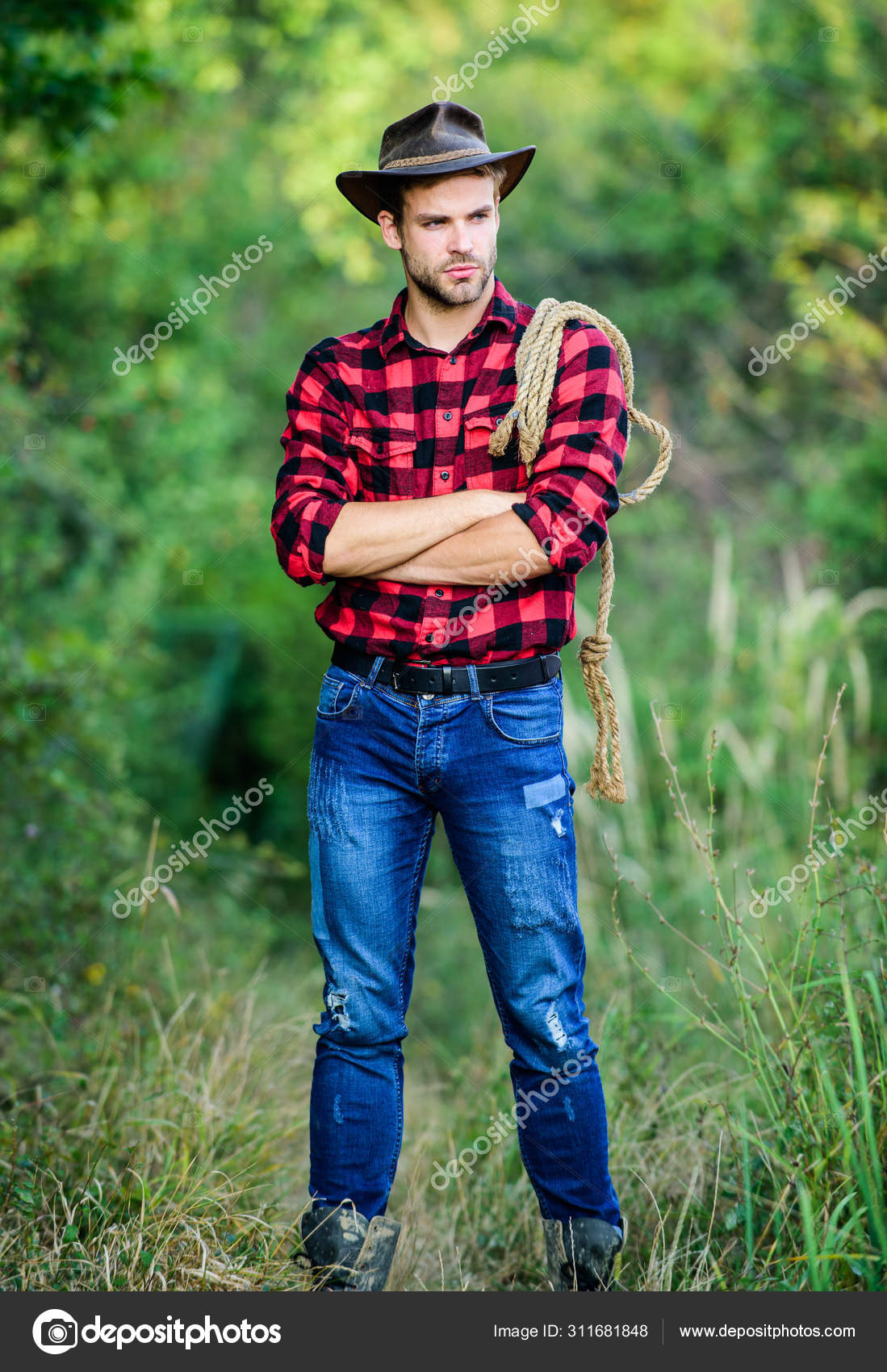 Homme Macho En Chapeau De Cowboy Homme Macho En Chemise à Carreaux Homme  Macho Occidental Portant Un Chapeau