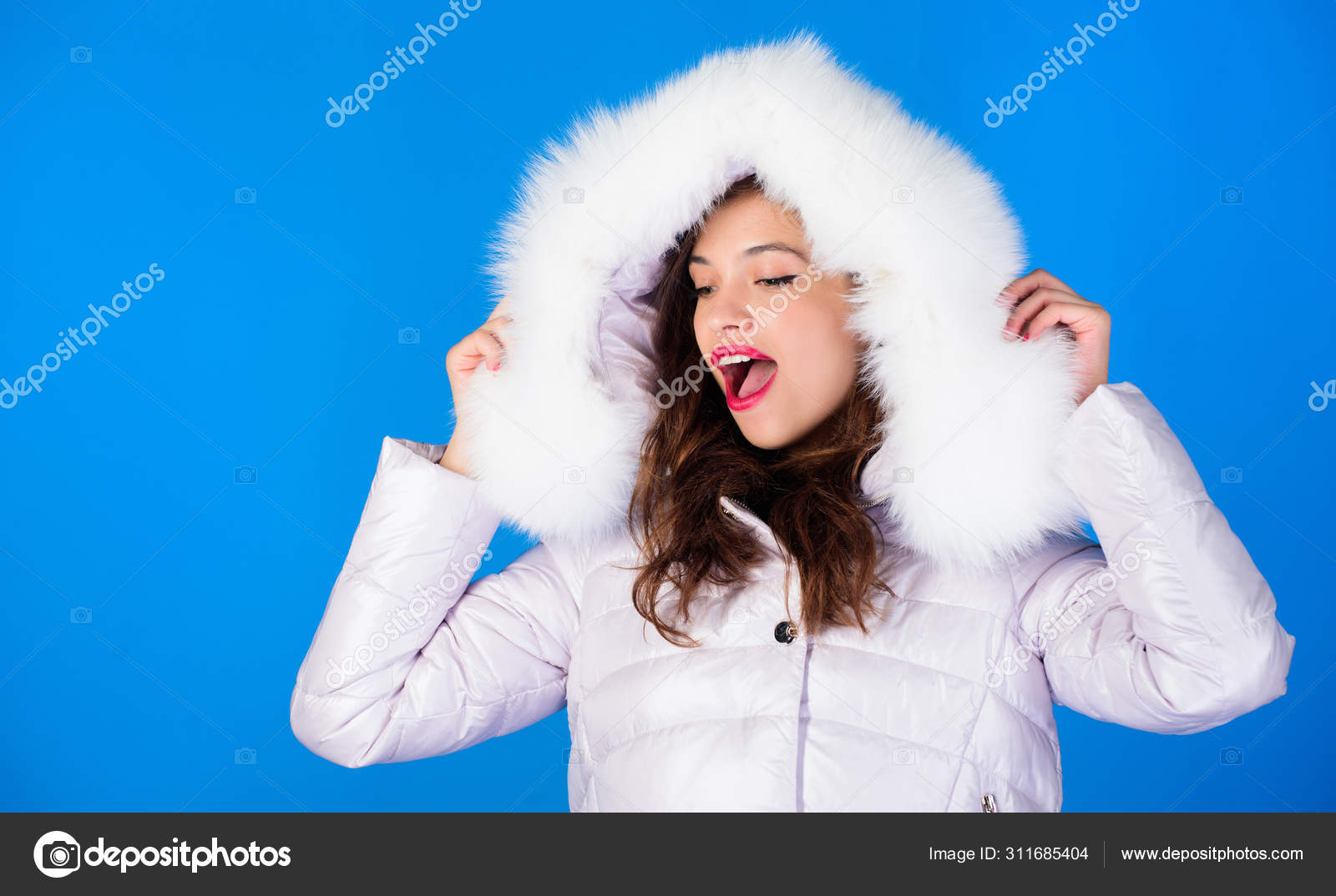 Soft fur. Winter clothes. Girl wear jacket blue background. season. Woman wear down jacket with furry Style code with elegance. For those wishing stay modern. Fashion trend Stock Photo