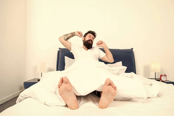 Nice morning. energy and tiredness. brutal sleepy man in bedroom. mature male with beard in pajama on bed. asleep and awake. bearded man hipster sleep in morning. Passed out. Time to wake up — Stock Photo, Image