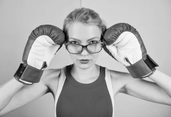 Smart and strong. Woman boxing gloves adjust eyeglasses. Win with strength or intellect. Strong intellect victory pledge. Know how defend myself. Confident her power. Strong mentally and physically