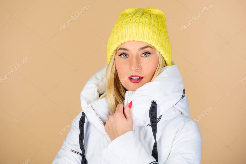 Perfect design. woman in padded warm coat. happy winter holidays. New year. girl in beanie hat. faux fur fashion. flu and cold. seasonal fashion. beauty in winter clothing. cold season shopping