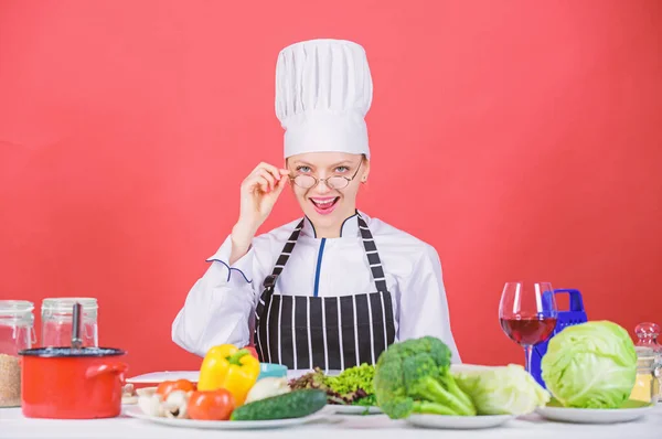 Culinary education. Culinary expert. Woman chef cooking healthy food. Fresh vegetables ingredients for cooking meal. Culinary school concept. Female in apron knows everything about culinary art