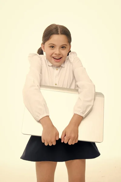 Study digital technologies.Child carry laptop for lesson. Digital equipment concept. Education and digital technology. Modern generation knowledge. Schoolgirl carry laptop for classes isolated white