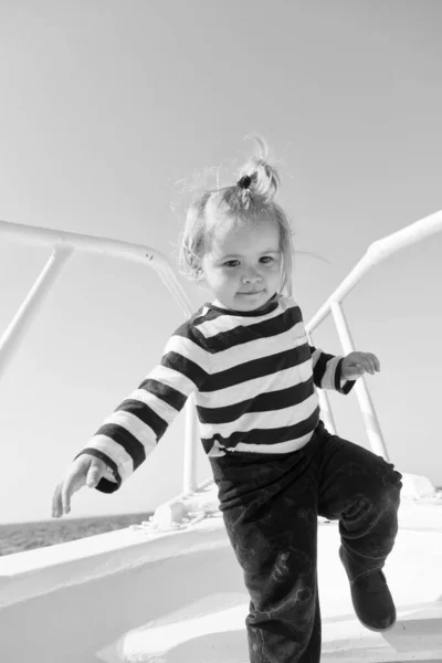 Funny kid in striped marine shirt. summer vacation. happy childhood. traveling adventures and wanderlust. happy little boy on yacht. boat trip by sea or ocean. little sailor on boat. marine lifestyle — Stock Photo, Image